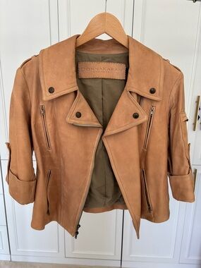 Donna Karan New York. Made in Italy. US4. 100% Lamb Short Sleeve Leather Jacket.